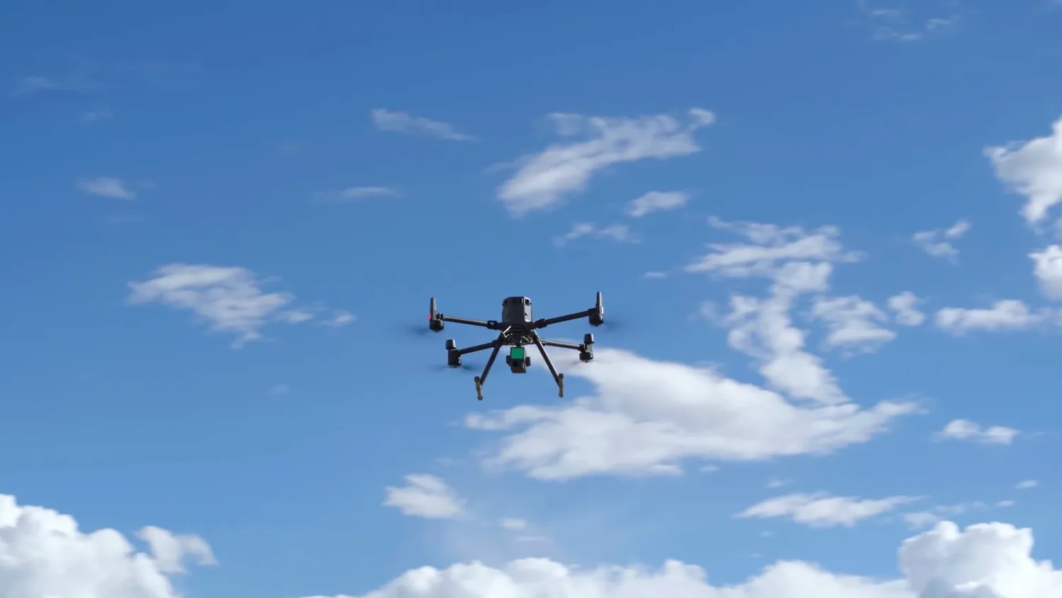 RTK survey drone holding altitude against a clear blue Costa Rican sky