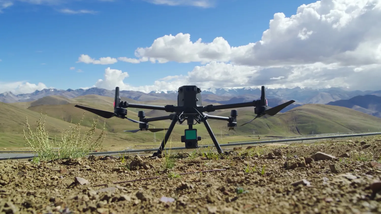 Survey drone on the ground with Costa Rican mountains and blue sky behind