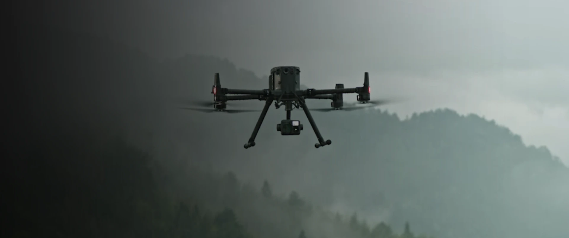 DJI Matrice LiDAR drone flying through misty Costa Rican forest canopy