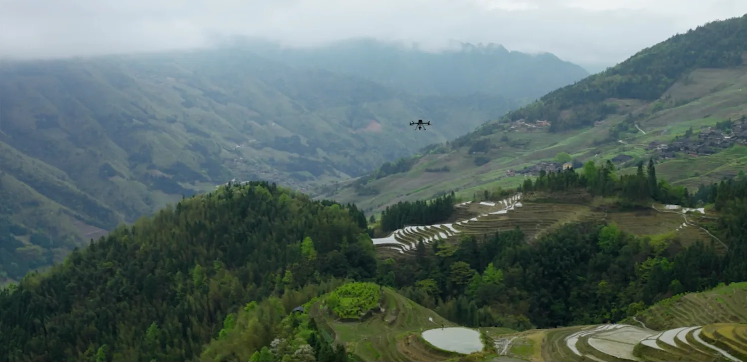 Survey drone flying over terraced agricultural land in Costa Rica