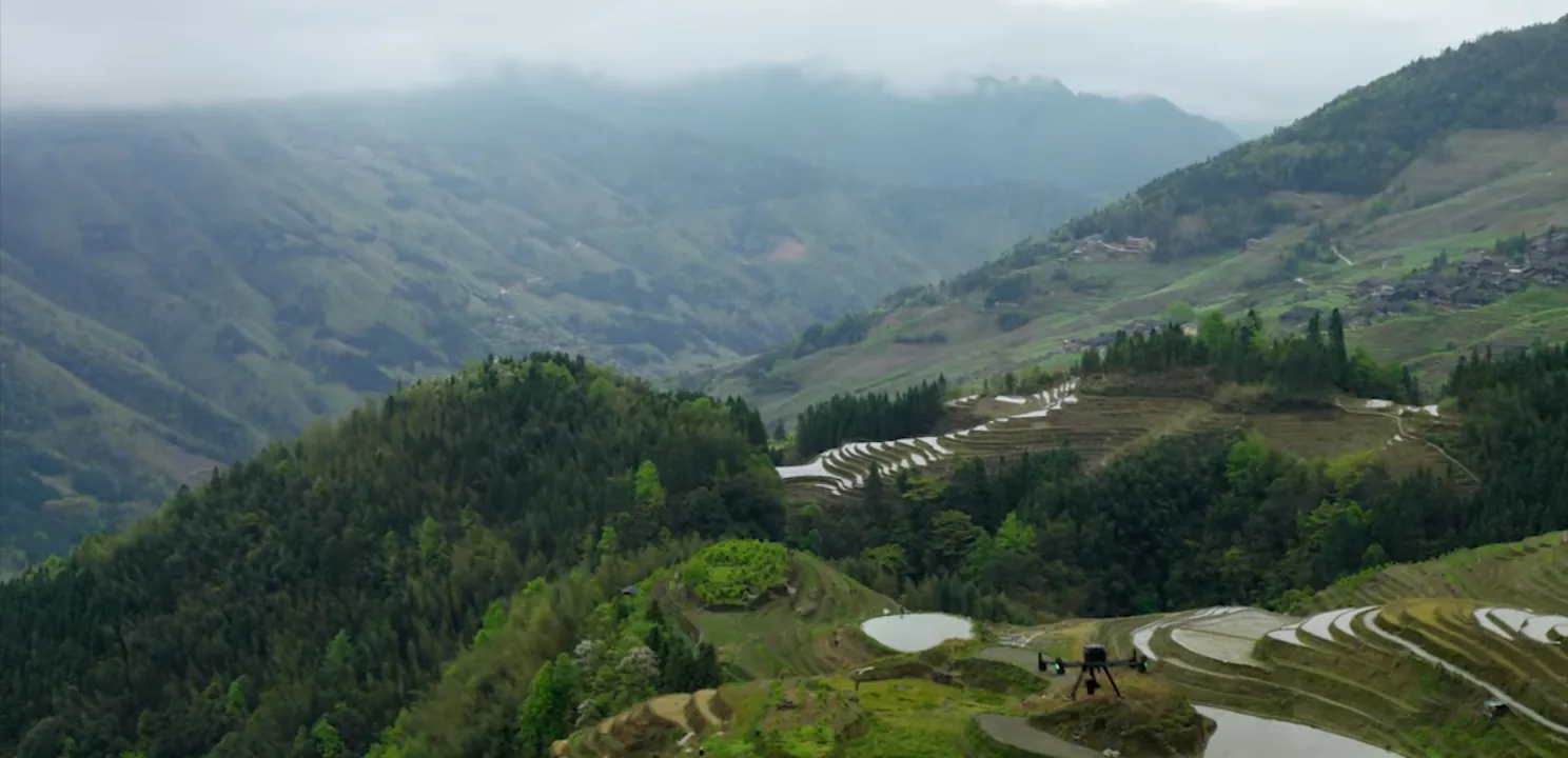Aerial view of a wide terraced valley landscape in Costa Rica captured by survey drone