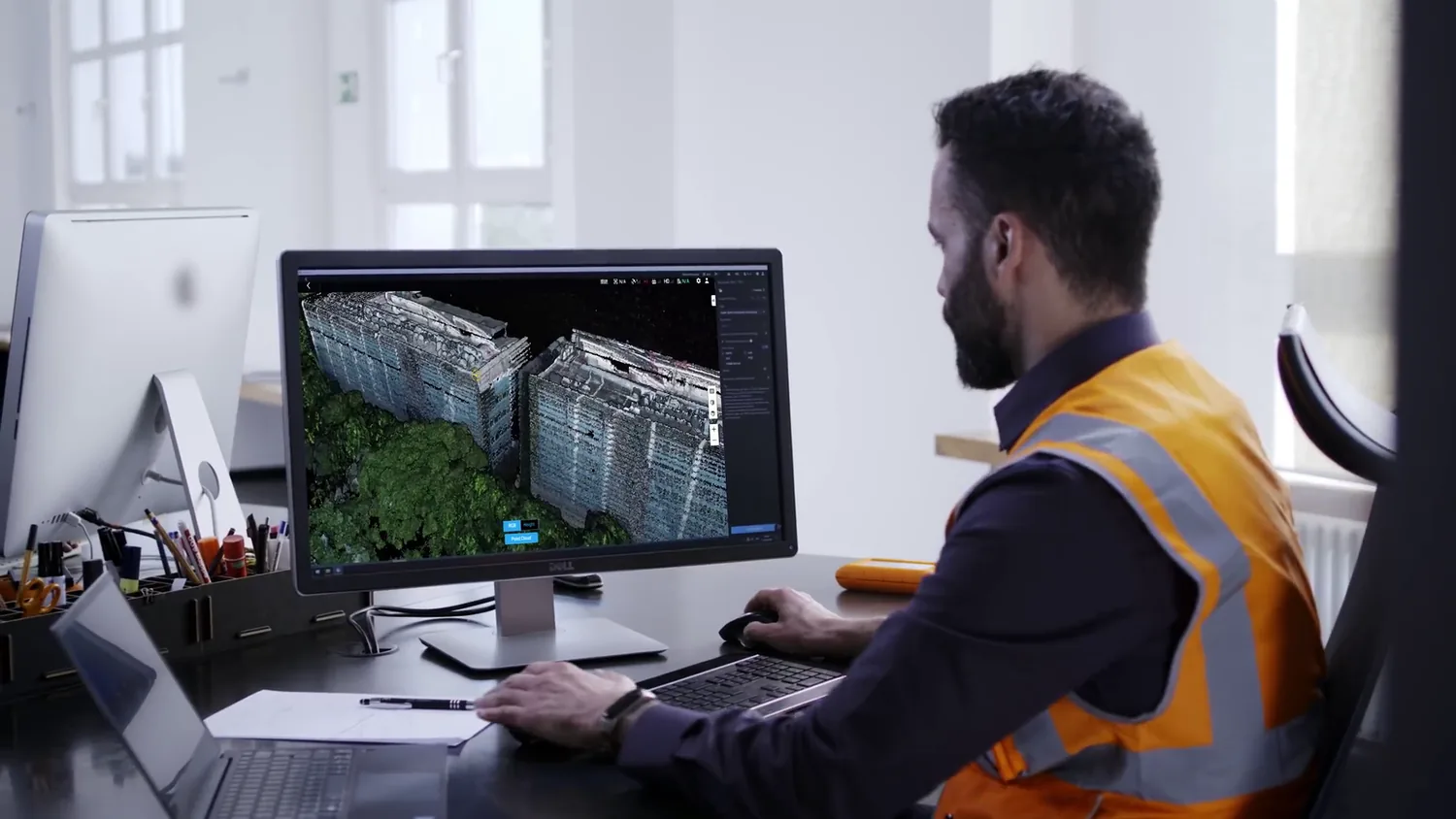 Engineer processing a 3D LiDAR point cloud at a workstation