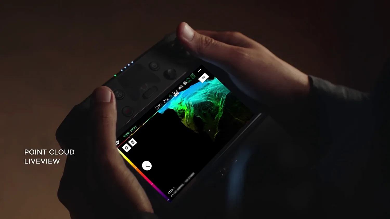 Handheld controller showing a live colored point cloud during flight